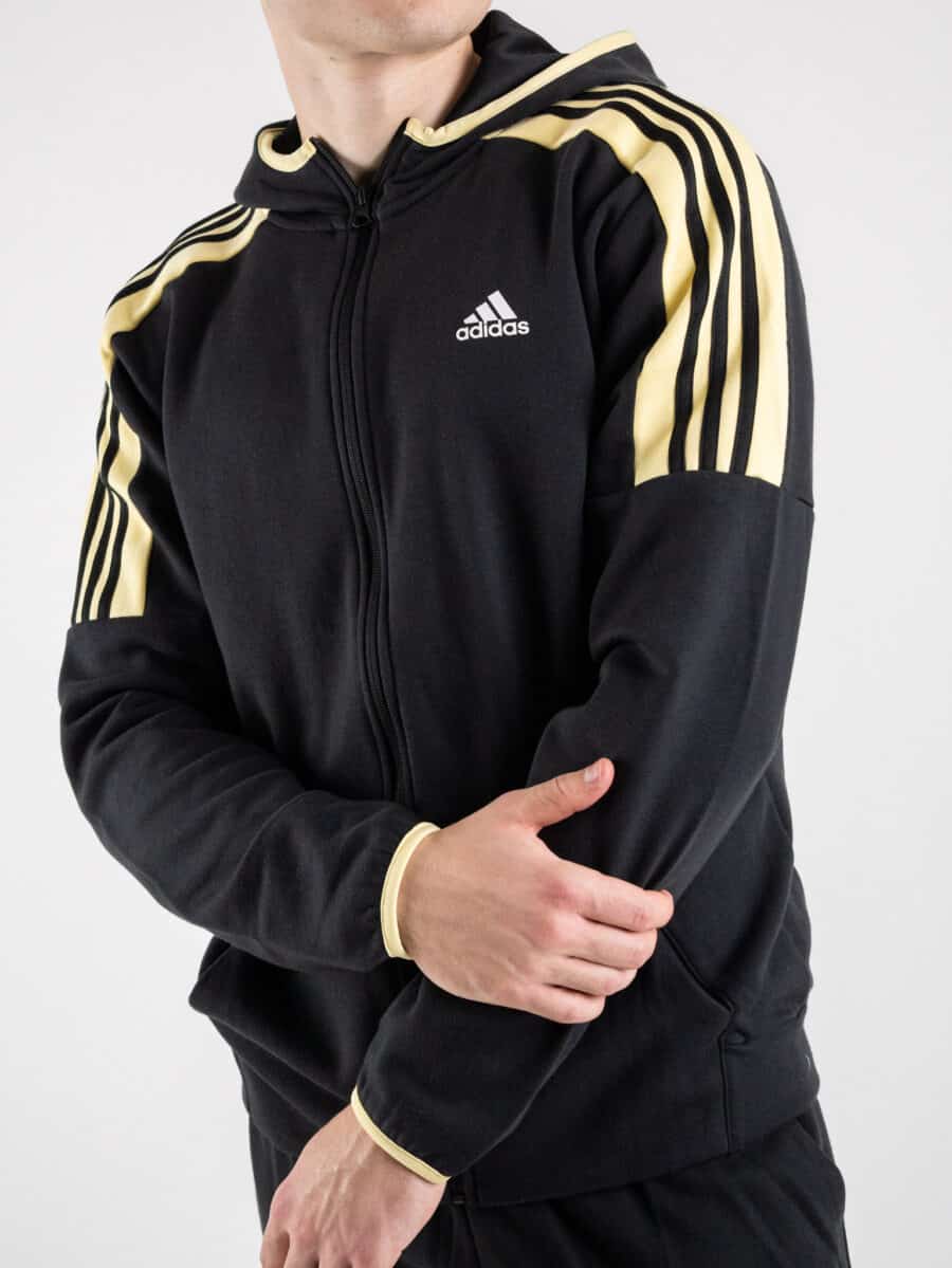 ADIDAS Felpa nera con cappuccio e zip, logo e fasce gialle HK4460