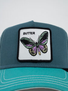 GOORIN BROS Cappellino verde acqua con patch in pelle bianca stampa farfalla BUTTER (1)